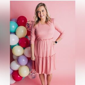Tiered pink dress with ruffle detailing